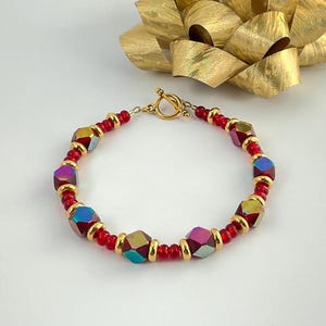 Handmade Ruby Red Aurora Borealis Crystals Bracelet: Gold Plated Clasp