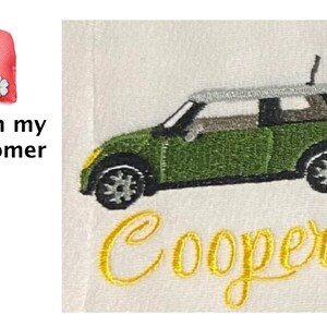 May include: Embroidered green Mini Cooper car with a white roof and the name "Cooper" stitched in yellow thread on a white background.