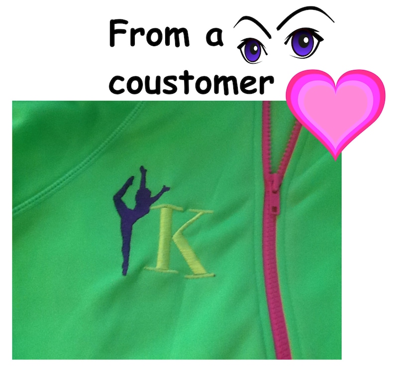 May include: Green zippered jacket with a pink zipper and a yellow embroidered letter K. A purple silhouette of a gymnast is embroidered next to the letter.