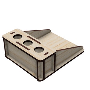 May include: Wooden organizer with four round holes and a slanted shelf. The organizer is made of light wood with dark brown trim.