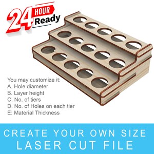 May include: A three-tiered wooden stand with 18 round holes for holding paint bottles. The stand is made of light brown wood and is designed to be laser cut. The text "CREATE YOUR OWN SIZE LASER CUT FILE" is printed below the stand.