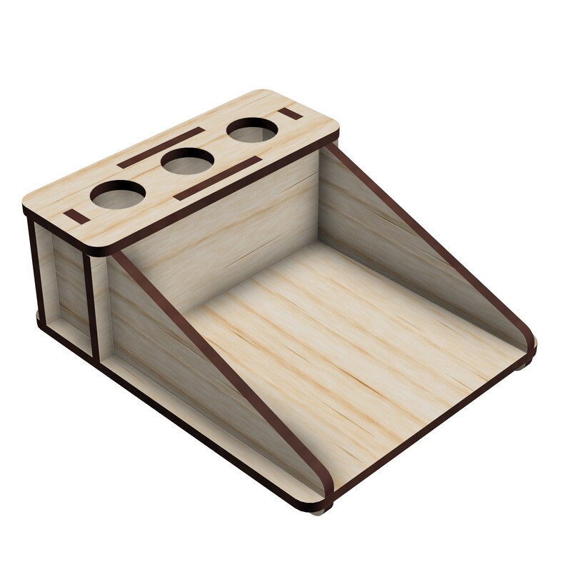 May include: Wooden desk organizer with three slots for pens or pencils and a large compartment for other items. The organizer is made of light wood with dark brown edges.
