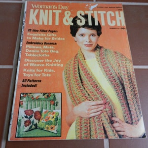 May include: A magazine cover for Woman's Day Knit & Stitch magazine, featuring a woman wearing a crocheted scarf in shades of green, orange, and brown. The cover text reads "20 Idea-Filled Pages: Exquisite Gifts to Make for Brides, Embroidery Bonanza: Pillows, Mats, Denim Tote Bag, Tablecloths, Discover the Joy of Weave-Knitting, Knits for Kids, Toys for Tots, All Patterns Included!"