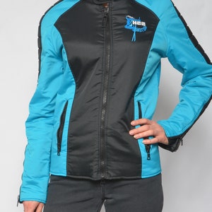 May include: A black and turquoise jacket with a zipper closure and a logo on the front that says "Hee Hotts".