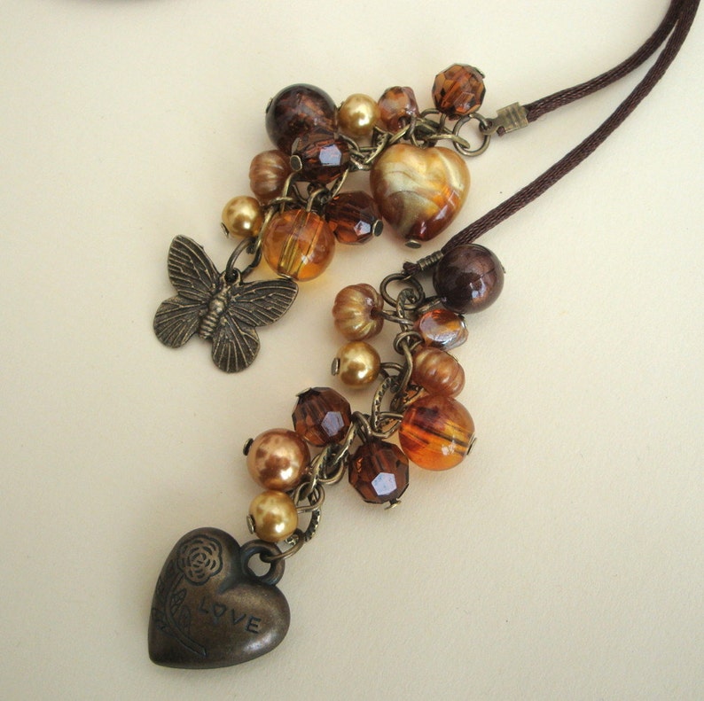 Lariat necklace brown bronze hearts butterflies beads on Etsy