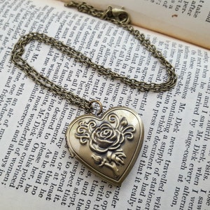 Locket necklace, heart shape in antique bronze, rose design on chain, vintage inspired style