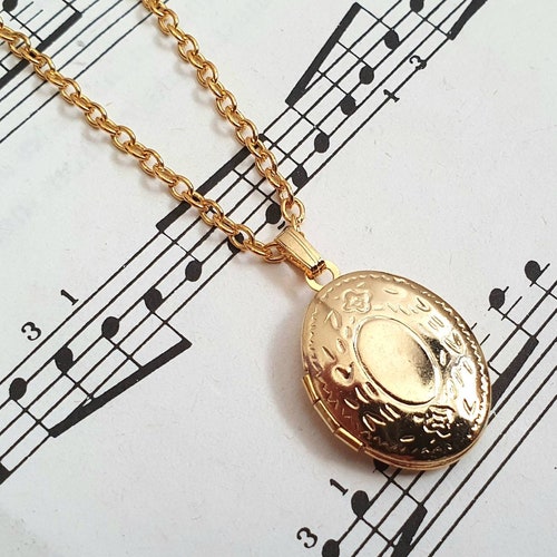 Gold plated small oval locket necklace on gold plated chain