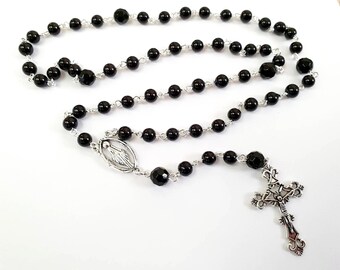 Rosary beaded necklace, black glass beads and silver crucifix