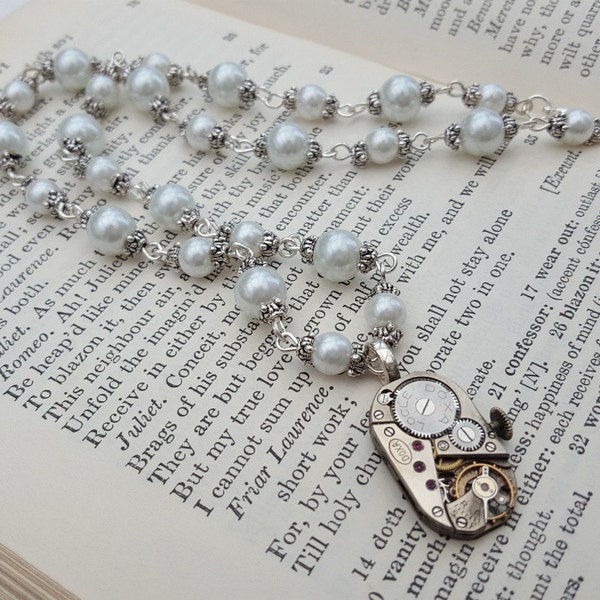 Steampunk necklace with watch movement beaded with white pearls