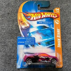 May include: A Hot Wheels Track Stars die-cast toy car in pink and black with the words "Track Stars" printed on the side. The car is on a blue and orange card with the words "Hot Wheels" and "Backdraft" printed on it.