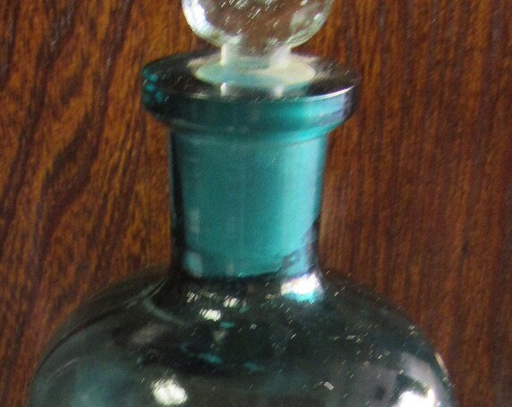 Antique blue apothecary jar with stopper