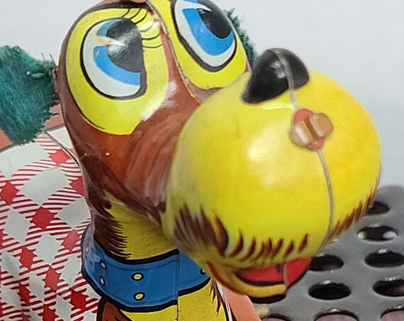 Tin wind up jumping dog