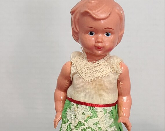 Celluloid wind up dancing doll