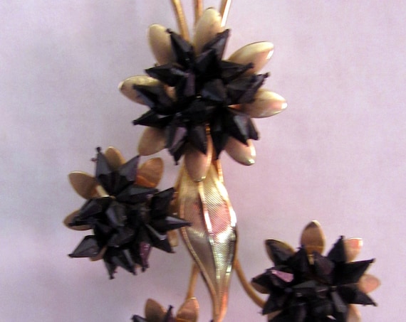 Black and gold flower brooch
