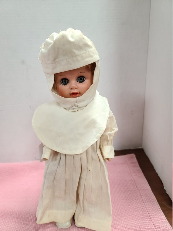 Nun doll in white habit