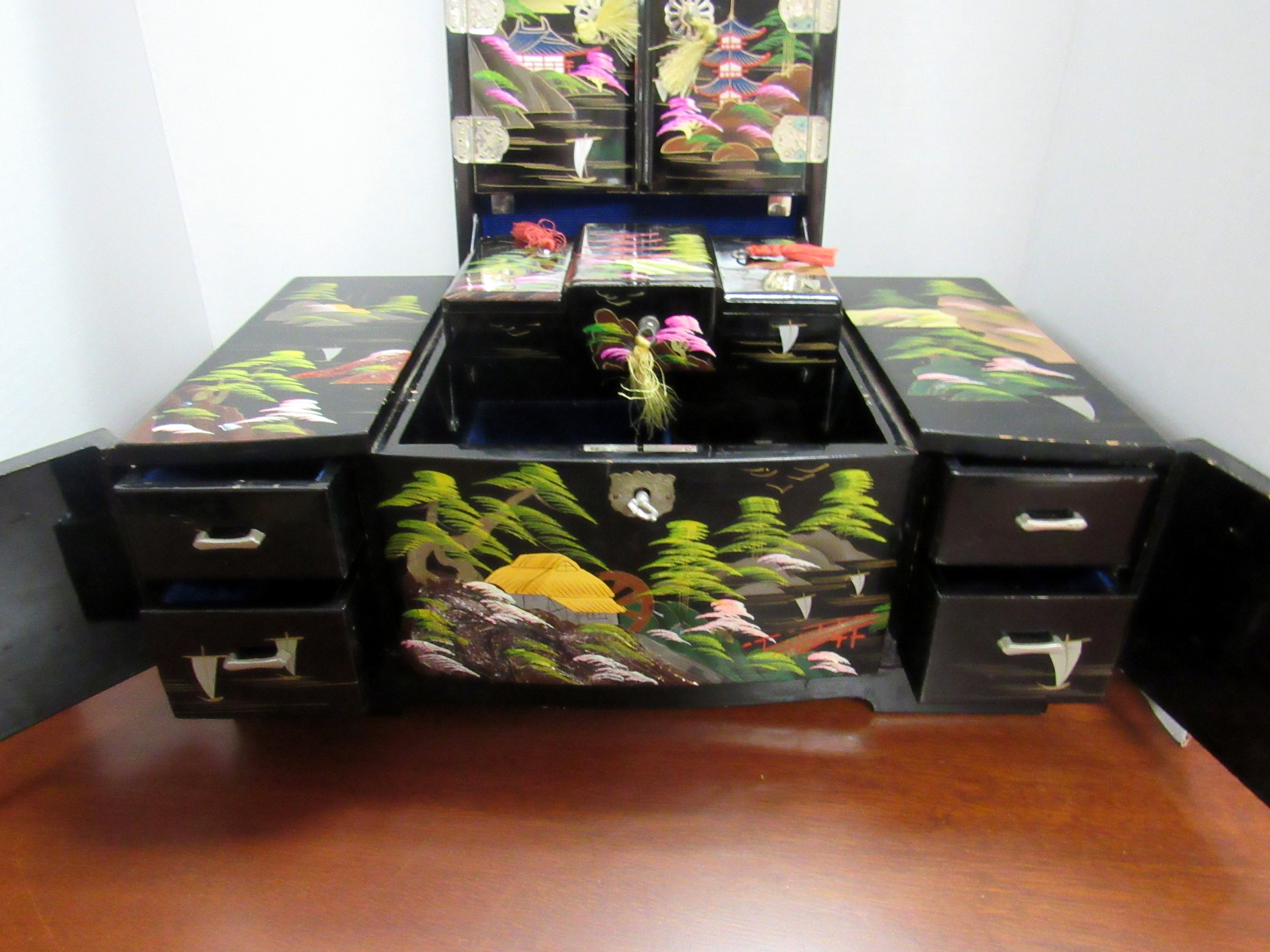 Asian black lacquer musical jewelry box with key