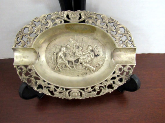 Nickel silver ashtray with men playing cards
