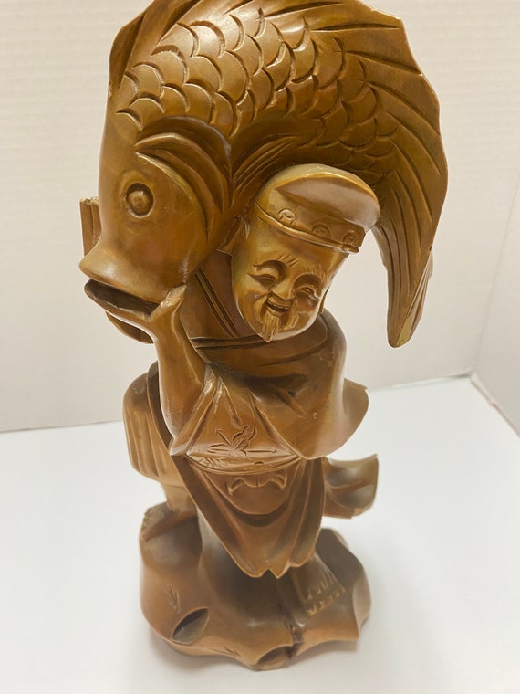 Man with Fish Wooden Statue