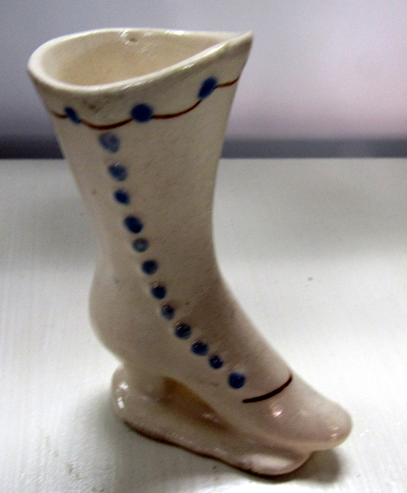 White ceramic miniature shoe