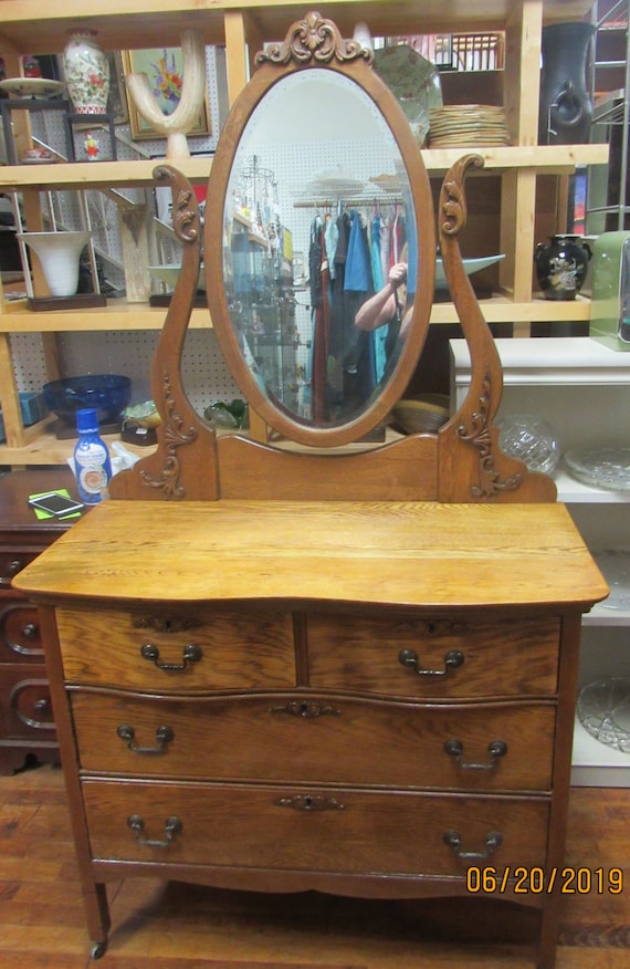 Oak dresser with oval mirror
