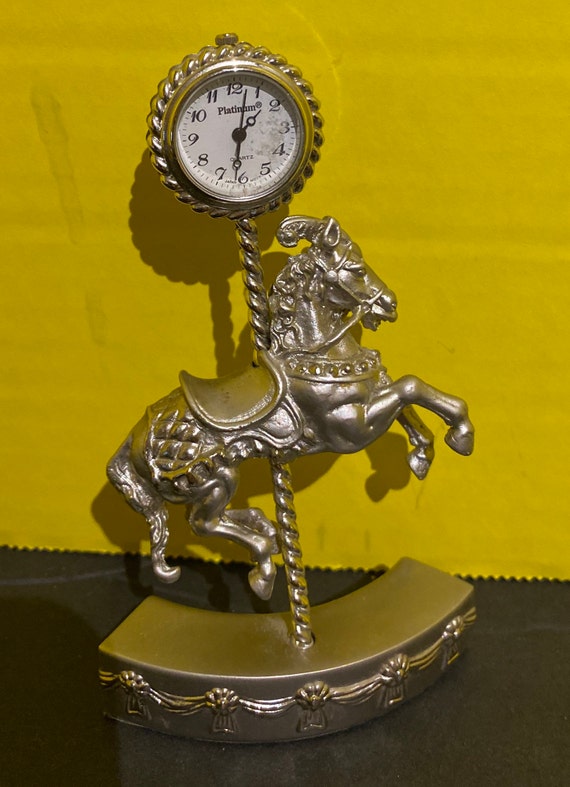 Miniature carousel horse clock