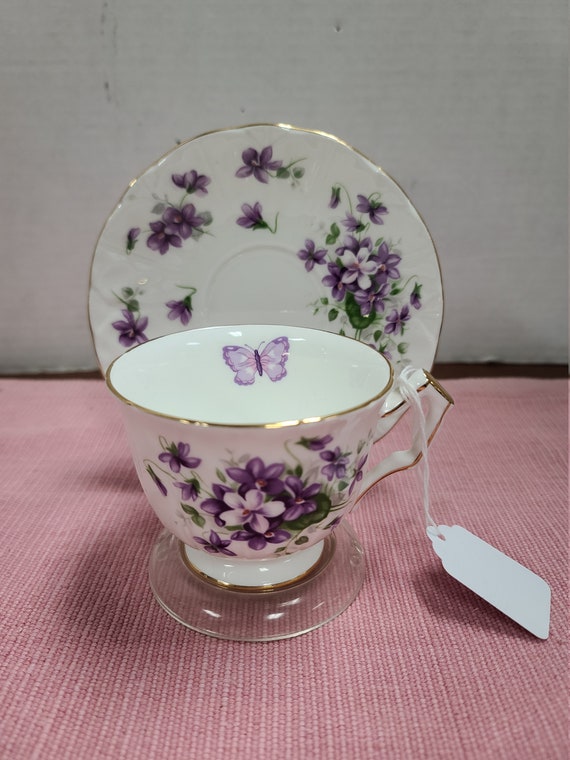 Aynsley fine english bone china cup and saucer with gold trim.