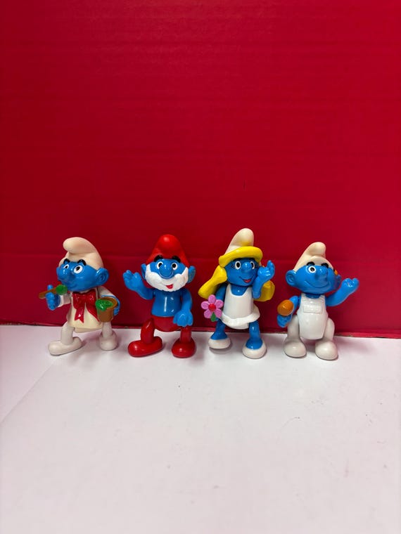 4 Smurf Figurines