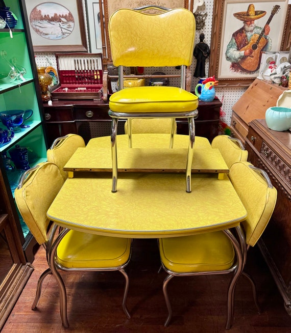 Yellow formica table with leaf and six chairs