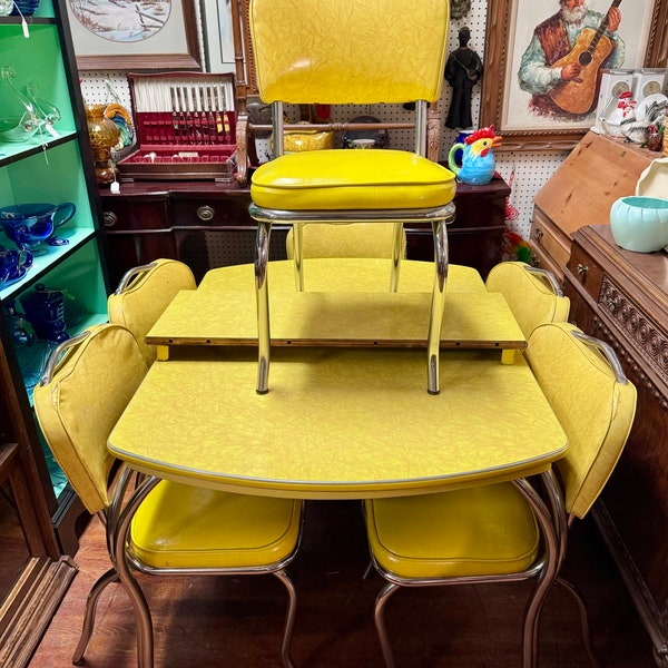 Yellow formica table with leaf and six chairs