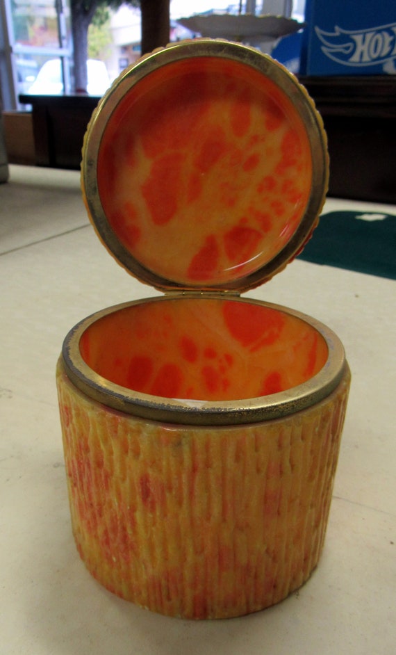 Orange container with hinged lid