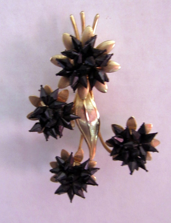 Black and gold flower brooch