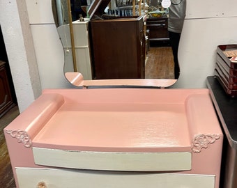 Pink and white dresser with mirror