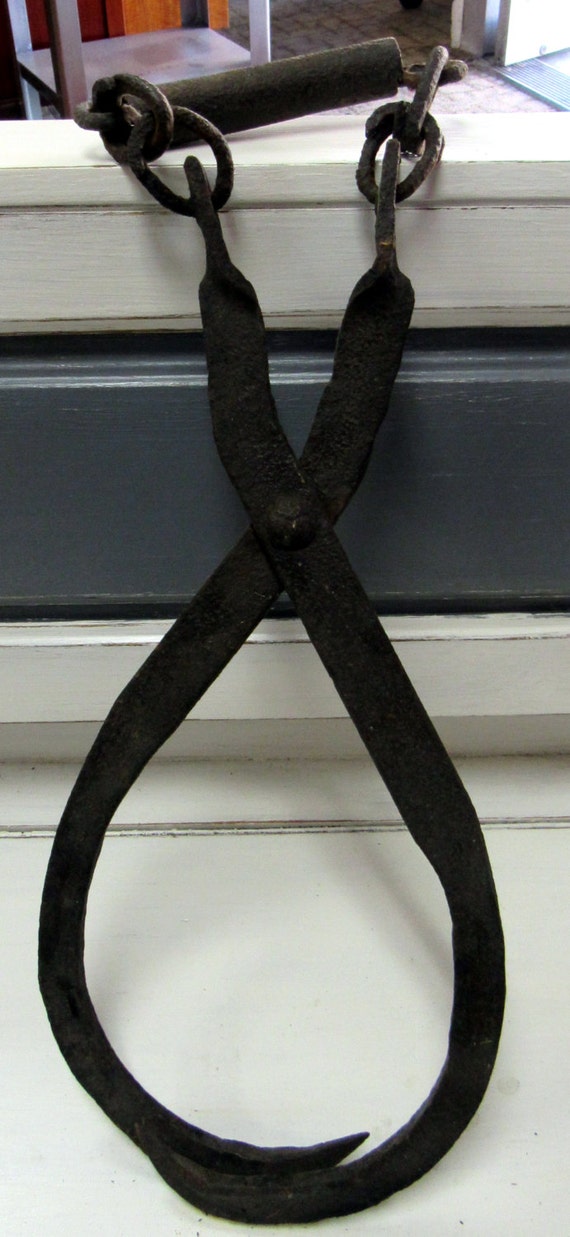 cast iron tongs for ice or hay