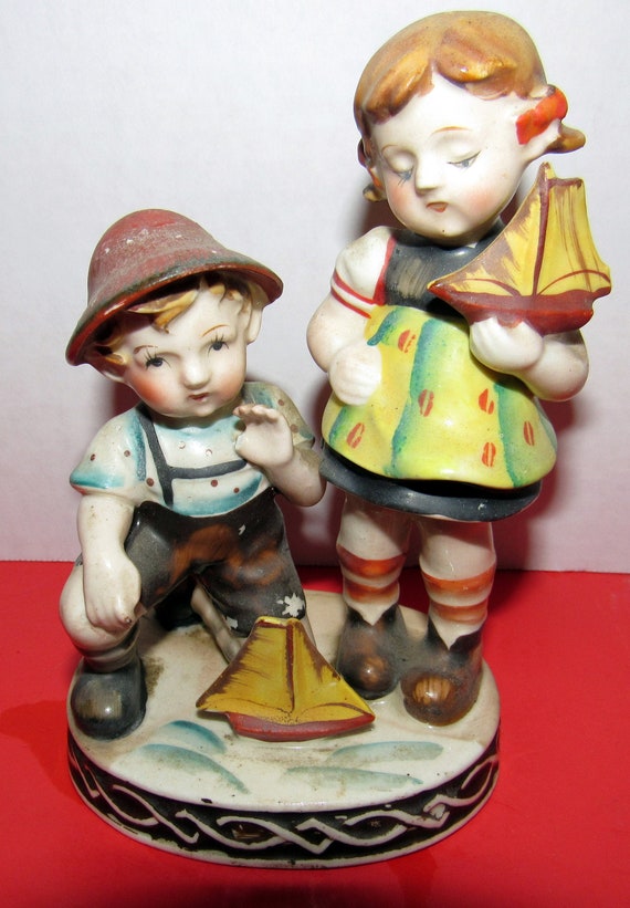 Occupied Japan Boy and Girl with sailboat figures