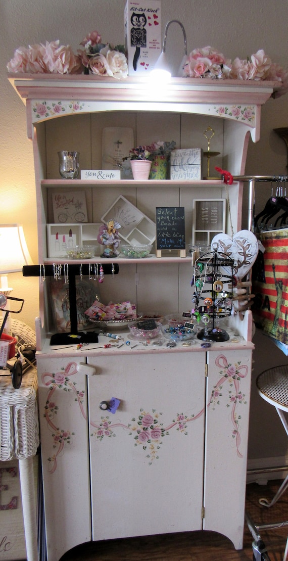 White and pink hutch cabinet