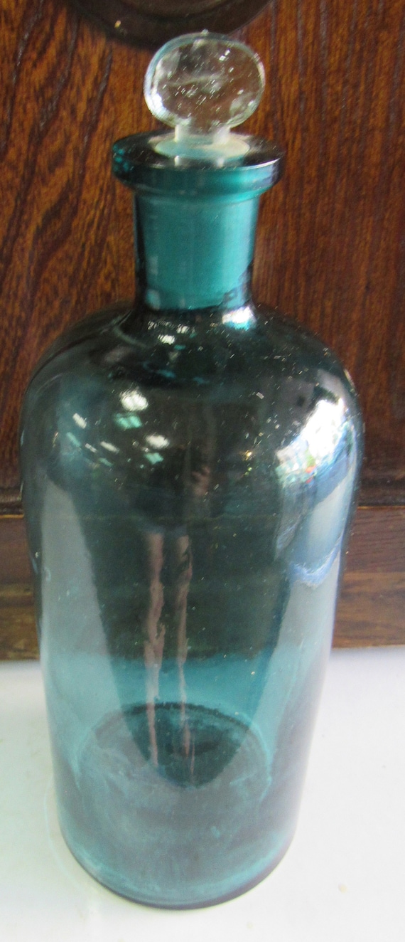 Antique blue apothecary jar with stopper