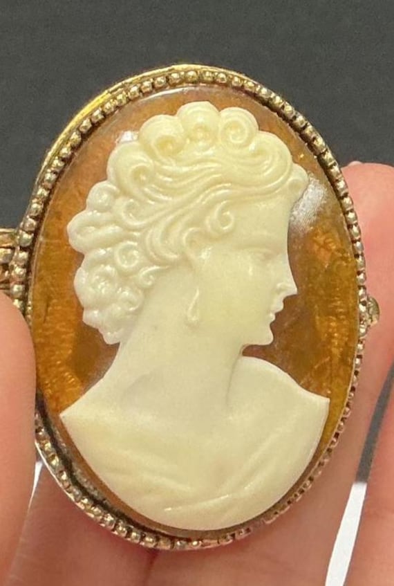 Gold tone Camero ring