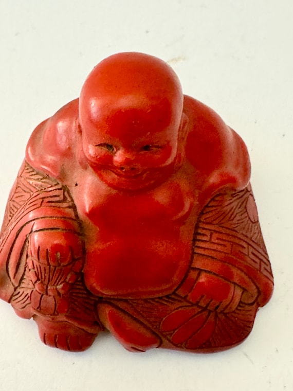 Cinnabar Buddha figure