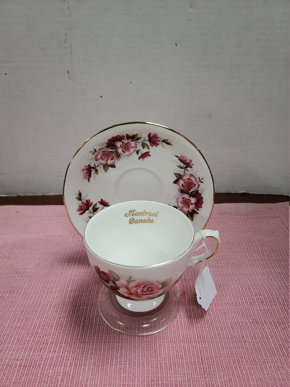 Queen Anne  bone china cup and saucer with gold trim.