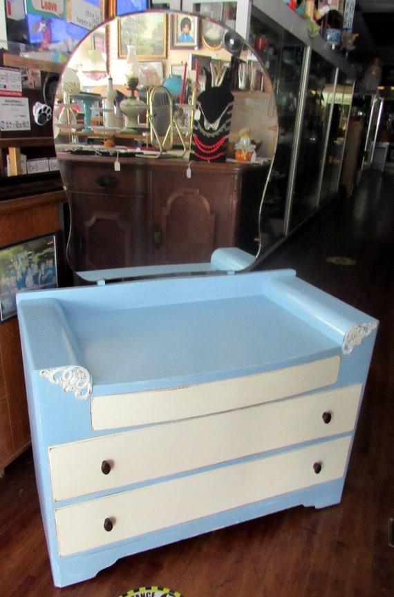 Blue and white dresser with mirror