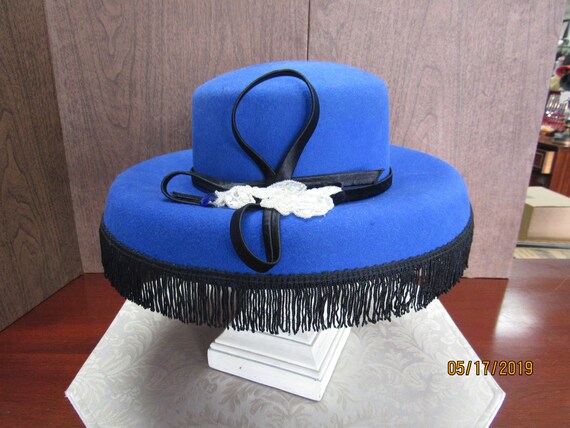 Royal blue hat with black fringe