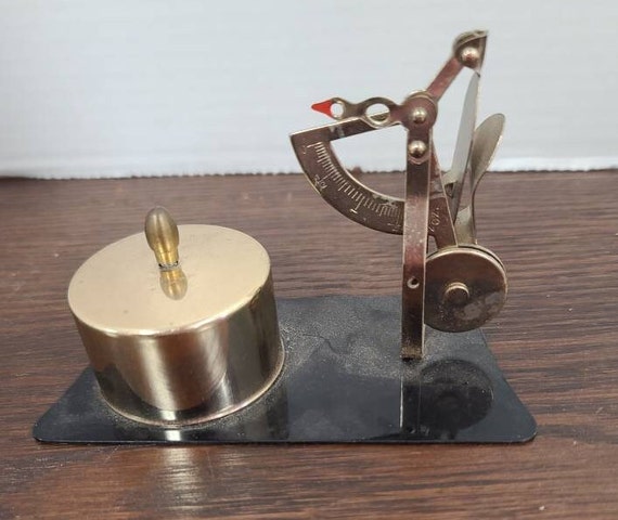 Mail scale with stamp holder