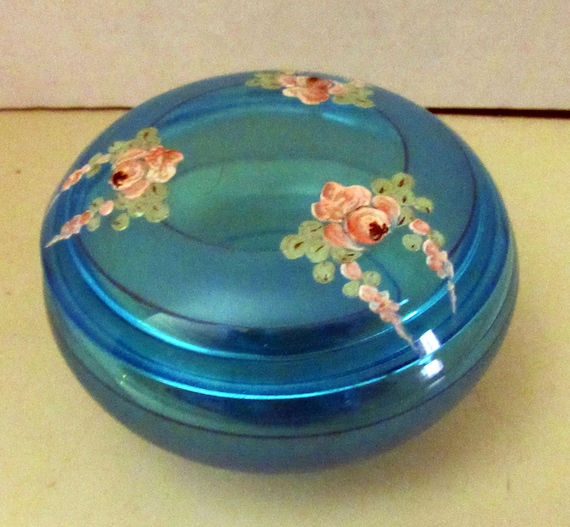 Aqua glass lidded jar with hand painted floral design