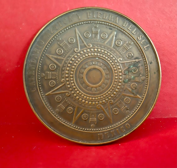 Aztec calendar coin