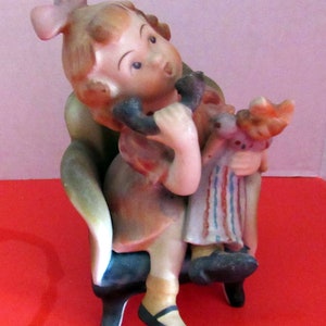 Girl on telephone figurine