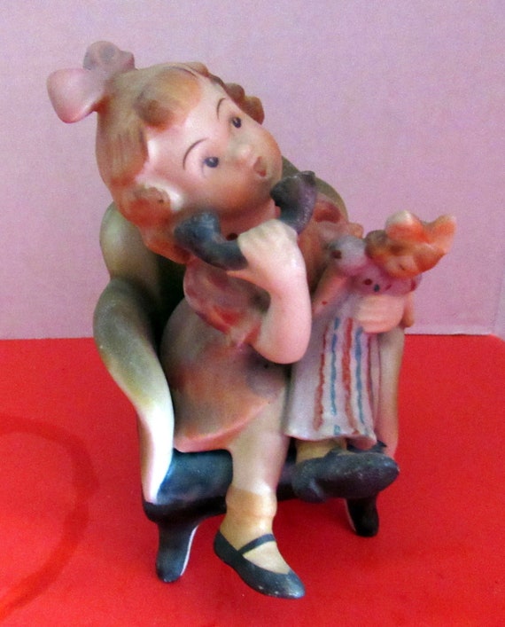 Girl on telephone figurine