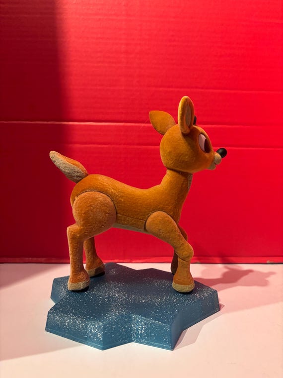 Rudolph Figurine on Ice Pedestal