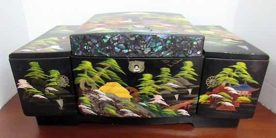 Asian black lacquer musical jewelry box with key