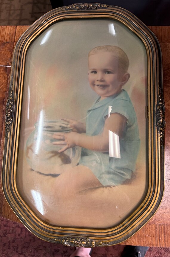 Bubble Glass oval framed boy with fish bowl