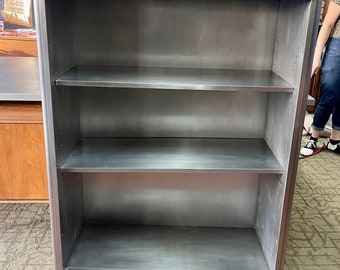 Brushed steel bookshelf